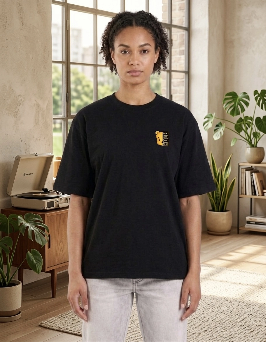 A girl who wear black t shirt pooh printed on the chest